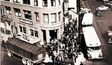 historic building buses taking people to camp